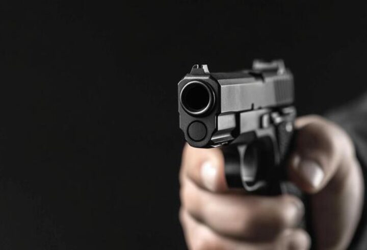 a-person-holding-a-gun-in-their-hand-photo (1)